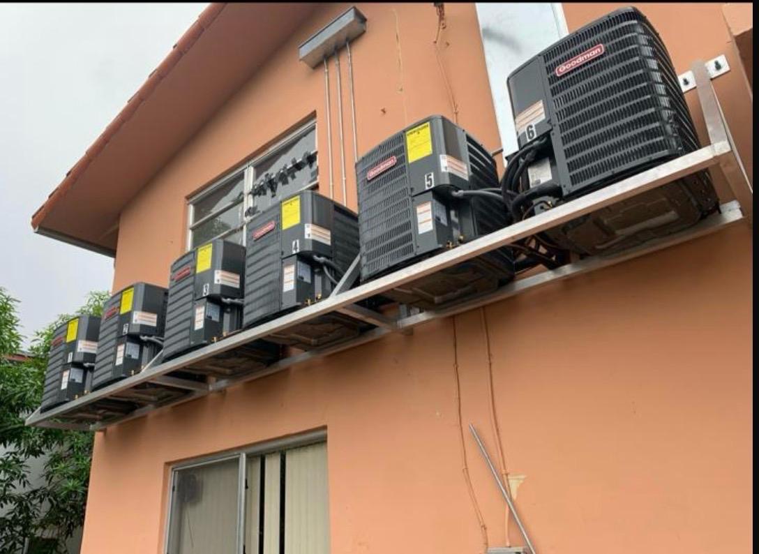 Multiple AC condenser units installed at a multi-unit property